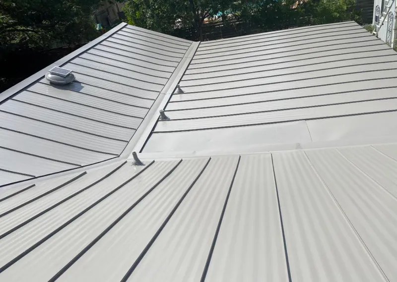 Solar attic fan installed on a metal roof for Roof Ventilation in Mammoth Lakes